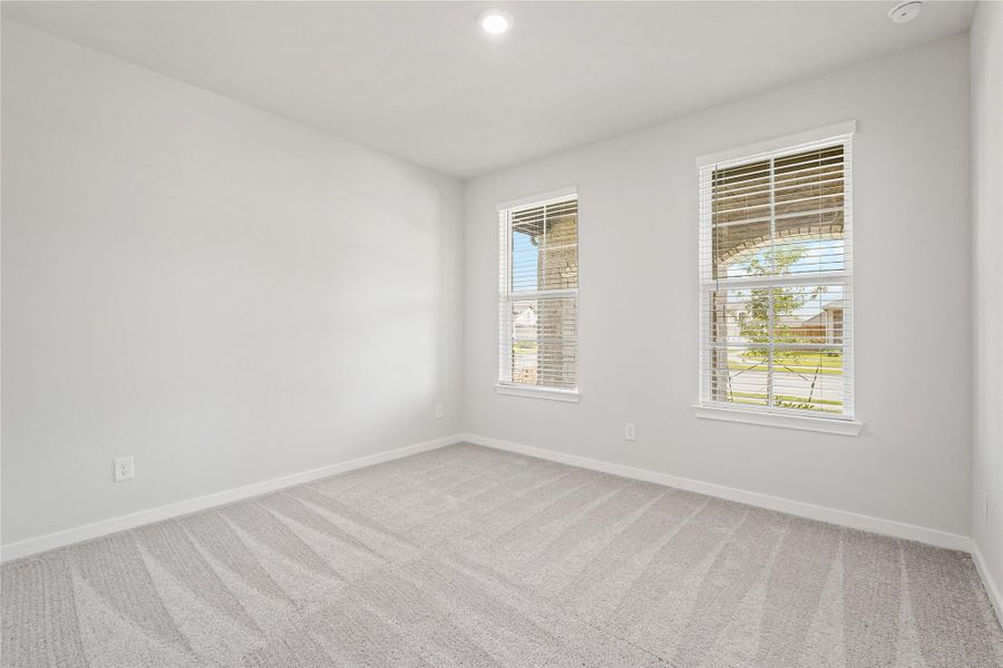 Spacious, unfurnished interior of a new home in Sunterra, Katy (Image 15).