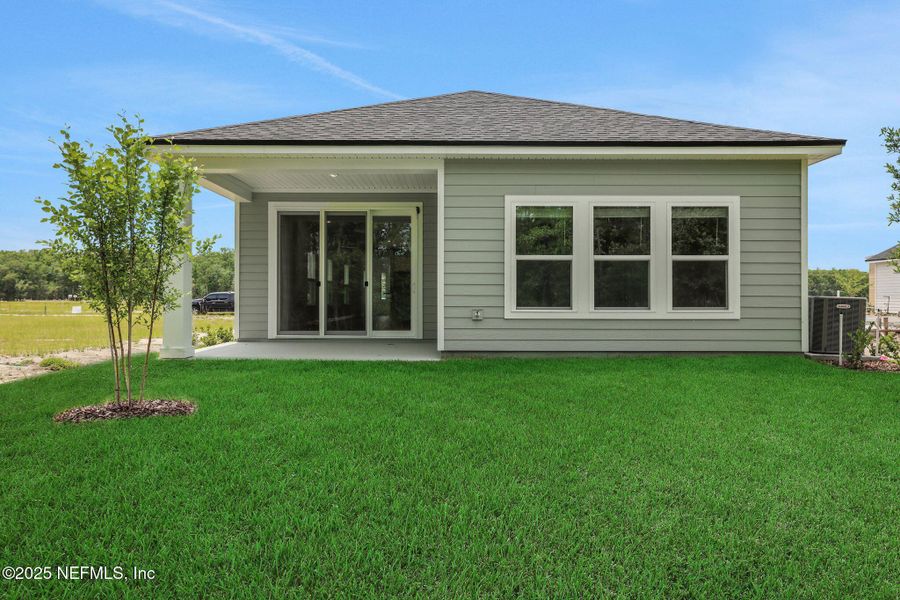 Front exterior of a new home in TrailMark, St. Augustine, FL, highlighting curb appeal (Image 23). Front exterior of a new home in TrailMark, St. Augustine, FL, highlighting curb appeal (Image 23).