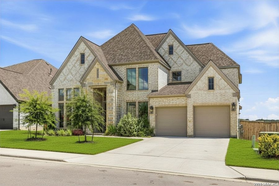 Front exterior of a new home in Ladera, San Antonio, TX, highlighting curb appeal (Image 1). Front exterior of a new home in Ladera, San Antonio, TX, highlighting curb appeal (Image 1).