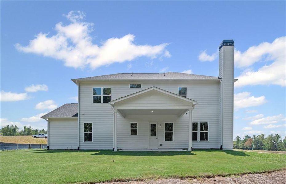 Front exterior of a new home in Traditions of Braselton, Jefferson, GA, highlighting curb appeal (Image 1).