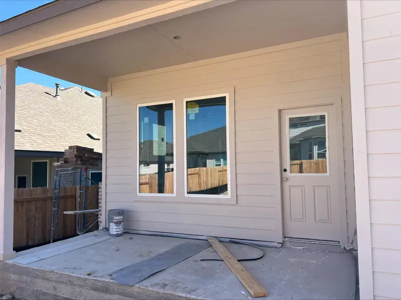 Doorway to property featuring a patio area