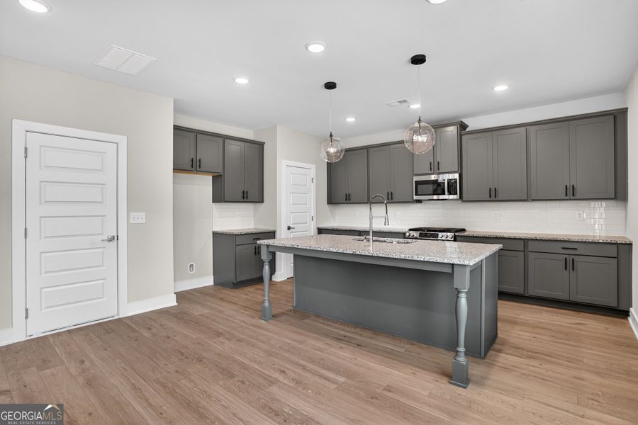 Furnished interior view inside a new home in The Fairways at Mirror Lake, Villa Rica (Image 5).
