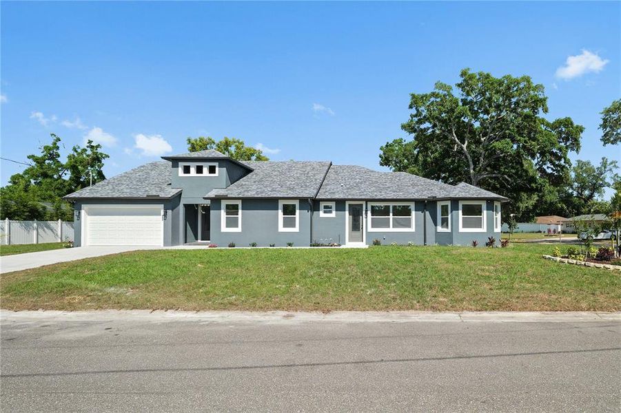 Front exterior of a new home in , Tampa, FL, highlighting curb appeal (Image 22).