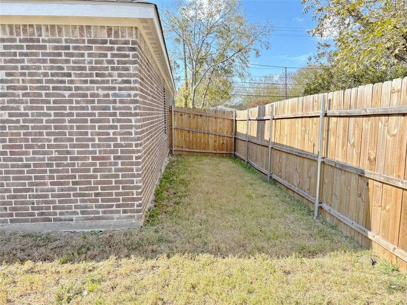 View of fenced backyard