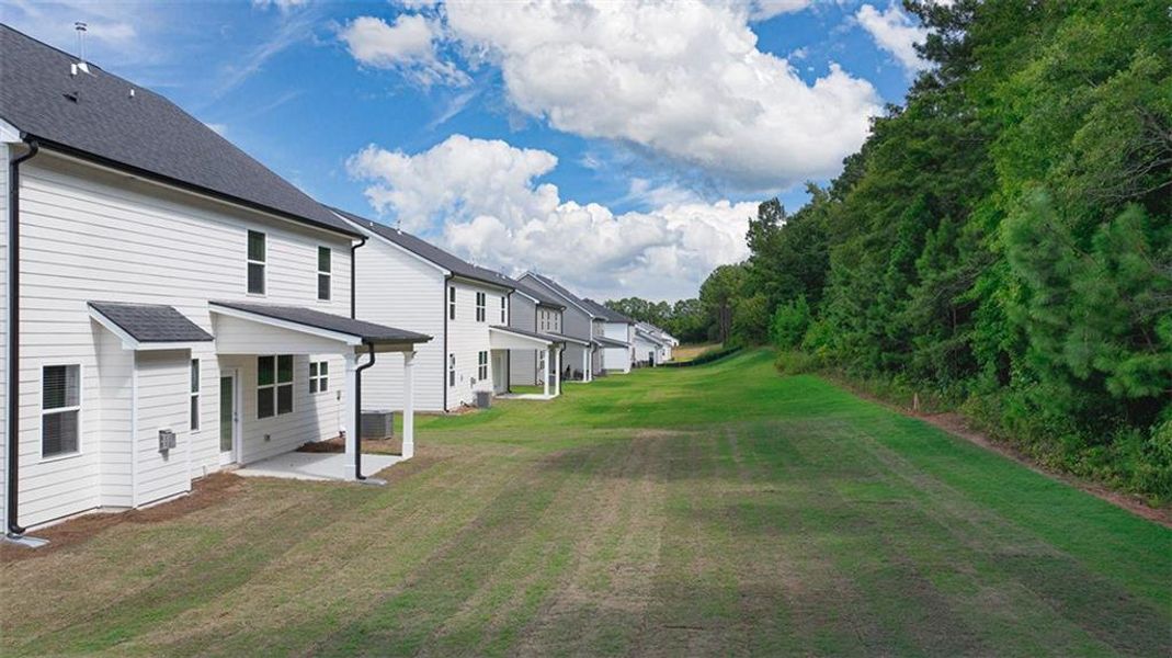 Front exterior of a new home in Preserve at Dove Creek, Statham, GA, highlighting curb appeal (Image 21).