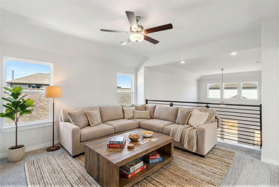 Upstairs, a versatile gameroom creates the ideal space for entertainment, work or play. Virtually staged representation of the upstairs game room.