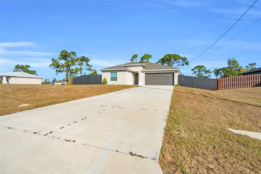 Front exterior of a new home in , Cape Coral, FL, highlighting curb appeal (Image 18). Front exterior of a new home in , Cape Coral, FL, highlighting curb appeal (Image 18).