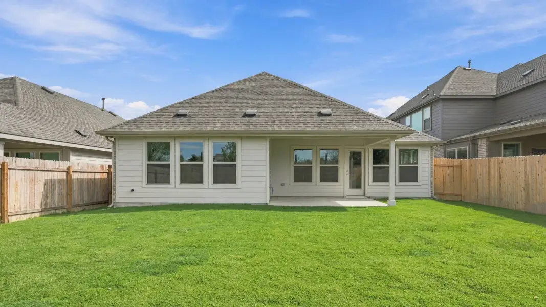 Exterior details and patio area of a home in Carillon, Manor (Image 4).