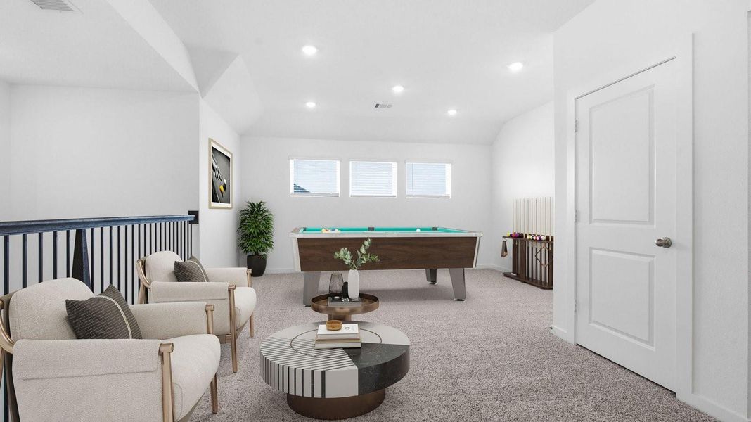 Primary bedroom with ceiling fan, plush carpeting, and a large walk-in closet.