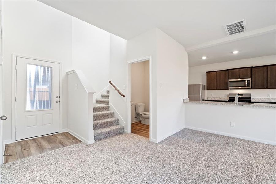 View of carpeted foyer