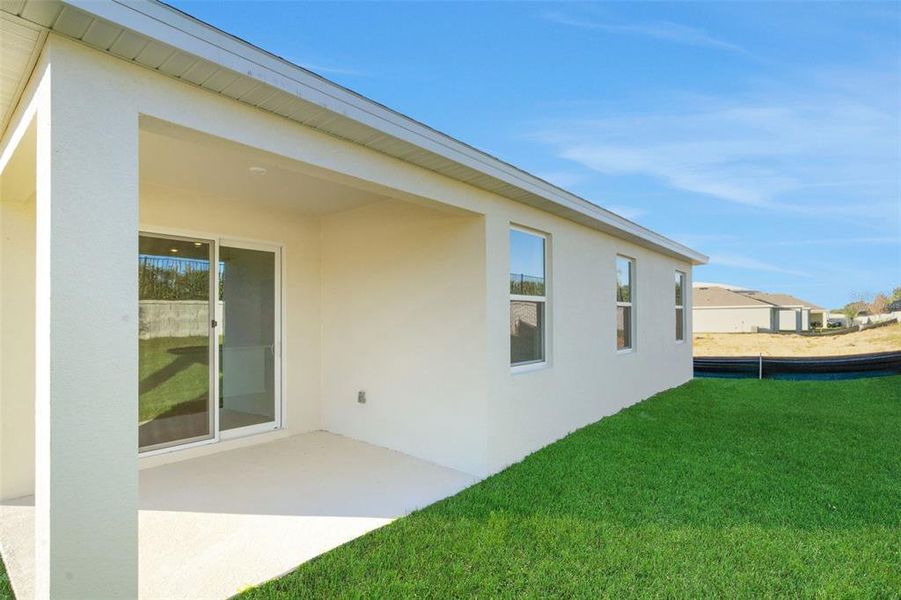 Exterior details and patio area of a home in Seaport Village, Tavares (Image 23).