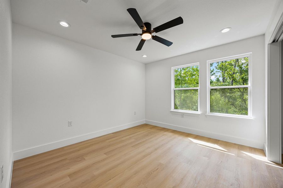 Empty room with light wood-style flooring, recessed lighting, and ceiling fan Empty room with light wood-style flooring, recessed lighting, and ceiling fan