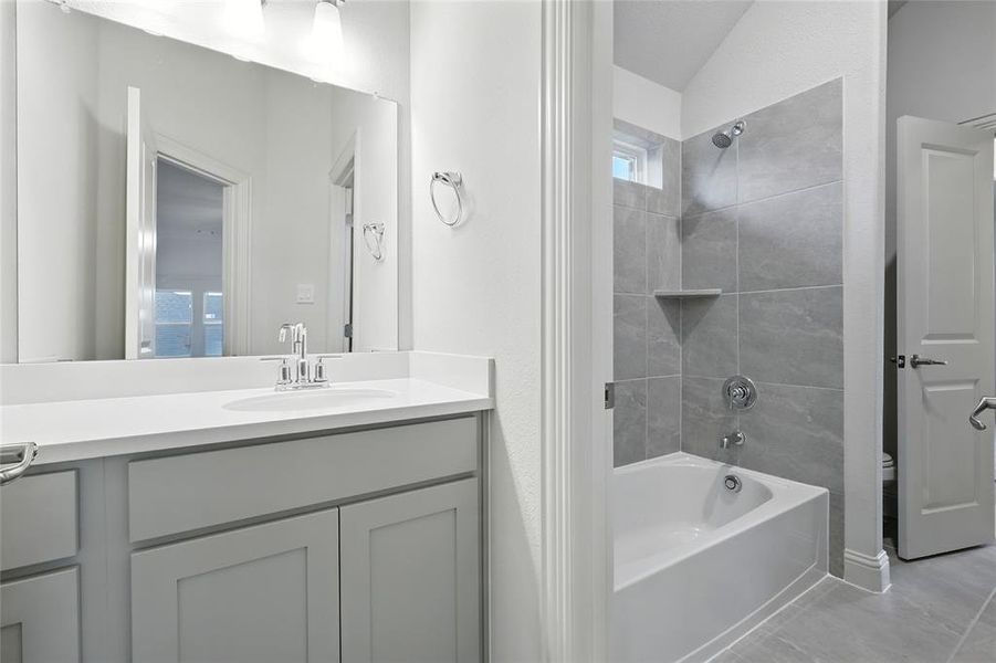 Bathroom with bathtub / shower combination and vanity