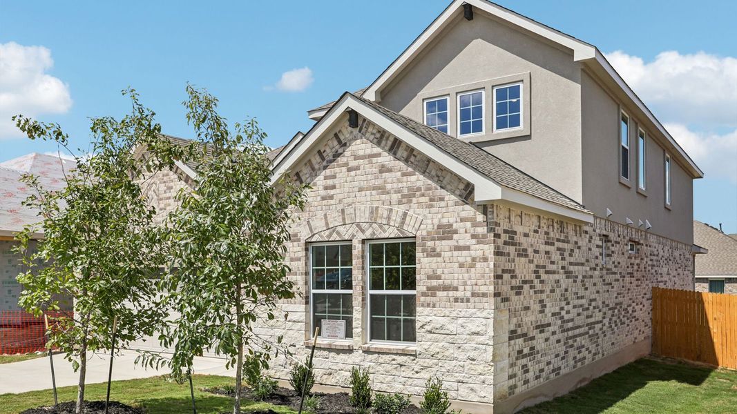 Front exterior of a new home in Rosenbusch Ranch, Leander, TX, highlighting curb appeal (Image 21).