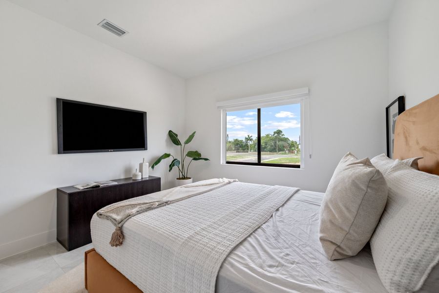Representative furnished interior of a home built from the Model E by Onx Homes in On Alba, Florida City (Image 43).