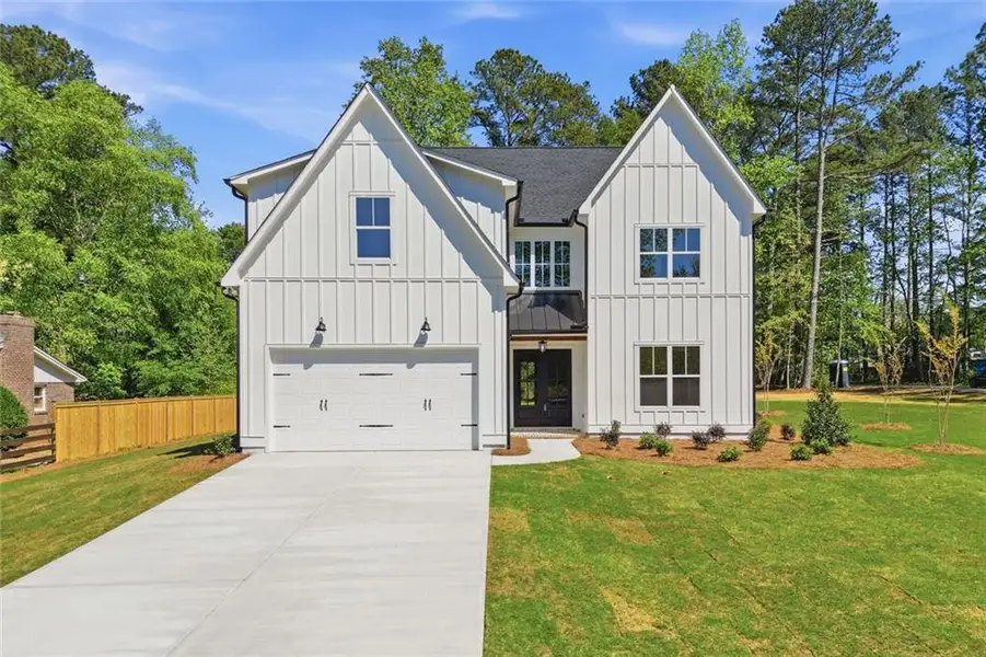 Front exterior of a new home in , Marietta, GA, highlighting curb appeal (Image 1). Front exterior of a new home in , Marietta, GA, highlighting curb appeal (Image 1).