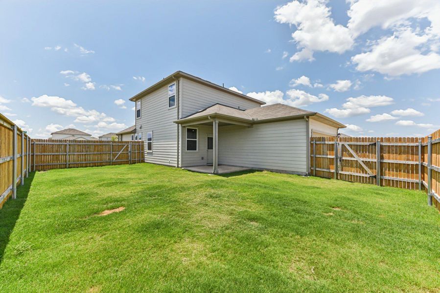 Exterior details and patio area of a home in Stonewall Ranch, Liberty Hill (Image 4).