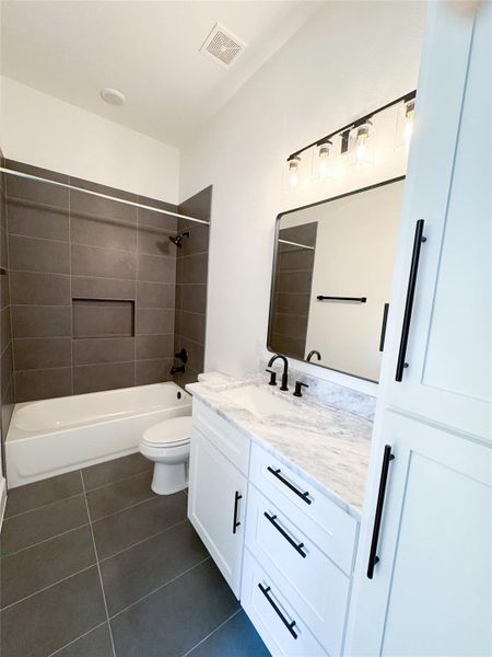 Secondary Bathroom with lots of Storage and Linen Closet