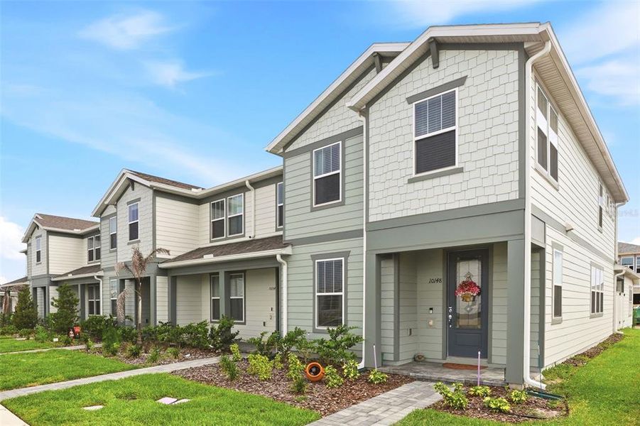 Front exterior of a new home in , Orlando, FL, highlighting curb appeal (Image 1). Front exterior of a new home in , Orlando, FL, highlighting curb appeal (Image 1).