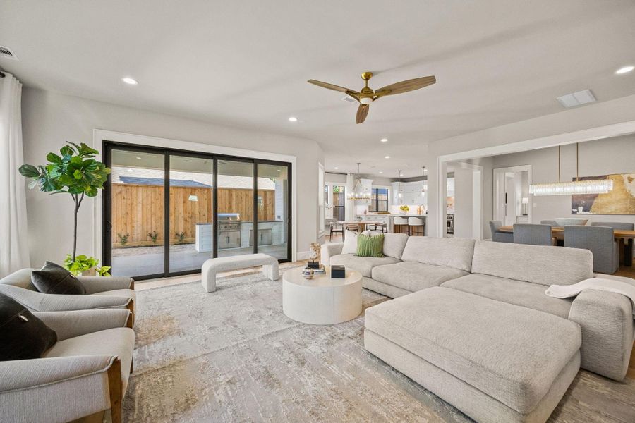 A Wall of sliding windows looks out to the Summer Kitchen.