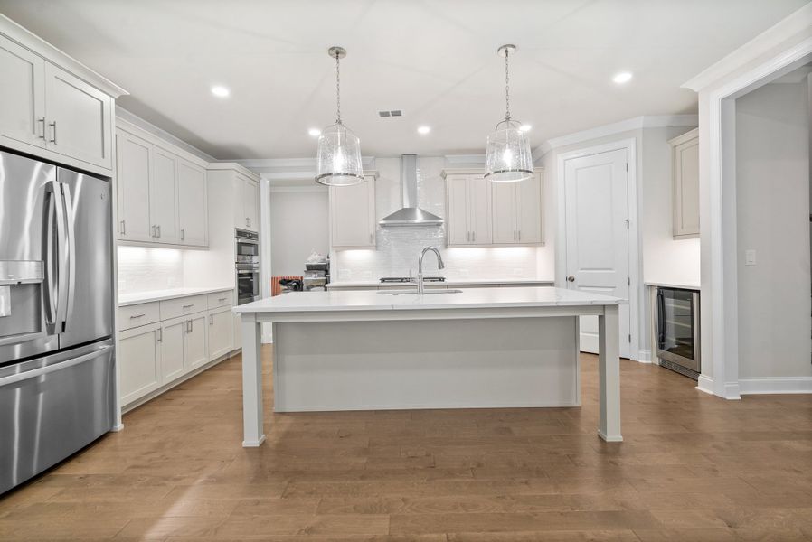Representative furnished interior of a home built from the The McIntosh by The Providence Group in Promenade at Sawnee Village, Cumming (Image 7).