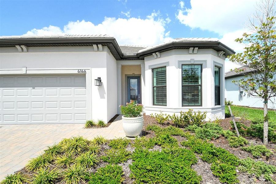 Exterior details and patio area of a home in , Nokomis (Image 28).