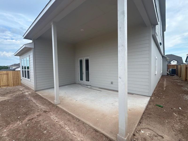 Back of house with a patio and french doors