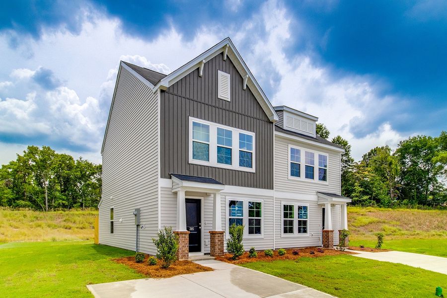 Front exterior of a new home in Padgett Commons, Hopkins, SC, highlighting curb appeal (Image 20). Front exterior of a new home in Padgett Commons, Hopkins, SC, highlighting curb appeal (Image 20).