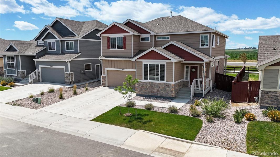 Front exterior of a new home in Ravina, Windsor, CO, highlighting curb appeal (Image 24). Front exterior of a new home in Ravina, Windsor, CO, highlighting curb appeal (Image 24).