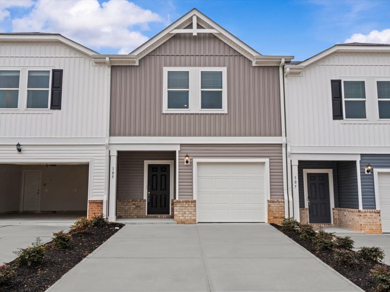 Front exterior of a new home in Northbrook Village Townes, Taylors, SC, highlighting curb appeal (Image 1).