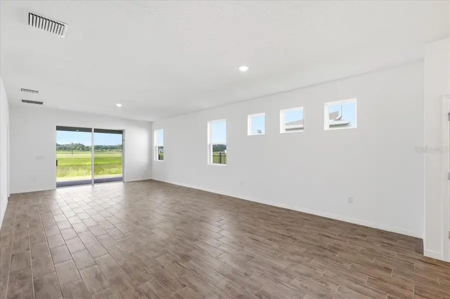 Spacious, unfurnished interior of a new home in Highfield at Twisted Oaks, Wildwood (Image 13).
