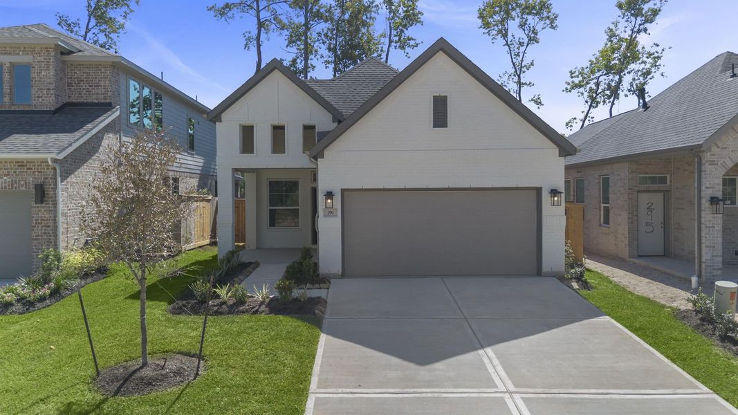 Front exterior of a new home in The Woodlands Hills, Willis, TX, highlighting curb appeal (Image 21). Front exterior of a new home in The Woodlands Hills, Willis, TX, highlighting curb appeal (Image 21).