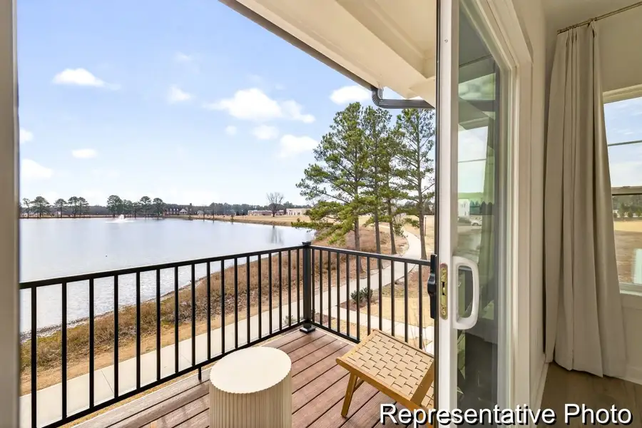 Exterior details and patio area of a home in North District at Flowers Plantation Townhomes, Clayton (Image 3). Exterior details and patio area of a home in North District at Flowers Plantation Townhomes, Clayton (Image 3).