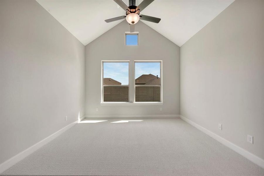 Vaulted ceiling featuring a ceiling fan with integrated lighting