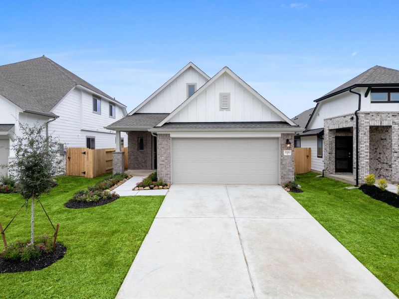 Front exterior of a new home in , Spring, TX, highlighting curb appeal (Image 2). Front exterior of a new home in , Spring, TX, highlighting curb appeal (Image 2).