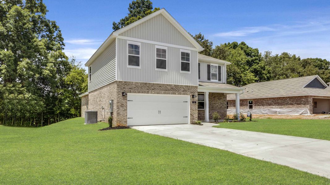 Front exterior of a new home in Bailey Park, Fayetteville, TN, highlighting curb appeal (Image 22).