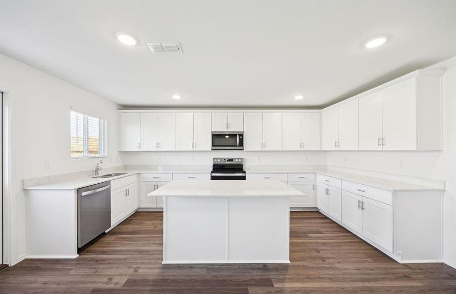 Spacious kitchen with large island Spacious kitchen with large island