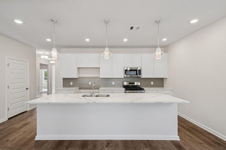 The Crawford- Kitchen. Home under construction, photo used for illustrative purposes only, colors and options will vary.