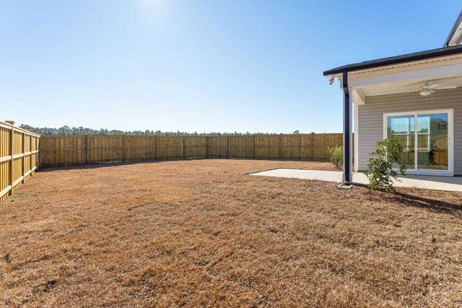 Exterior details and patio area of a home in River Tide Farms, Bolivia (Image 21).