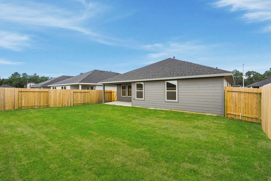 Exterior details and patio area of a home in Grand Pines, Magnolia (Image 15).