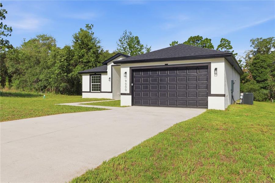 Front exterior of a new home in , Citrus Springs, FL, highlighting curb appeal (Image 2). Front exterior of a new home in , Citrus Springs, FL, highlighting curb appeal (Image 2).