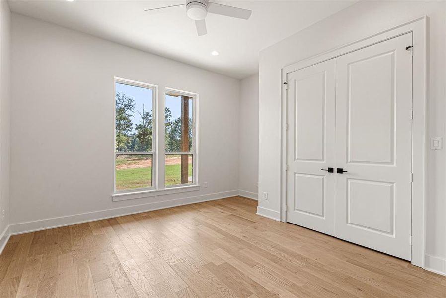 Unfurnished bedroom with ceiling fan, light wood finished floors, recessed lighting, and a closet