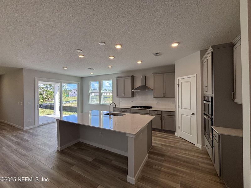 Furnished interior view inside a new home in The Magnolia Series at Reserve East, Flagler Beach (Image 10).