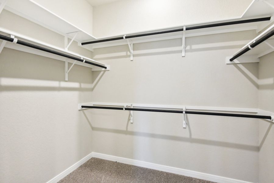 Primary suite walk-in closet in the Medina floorplan at a Meritage Homes community.