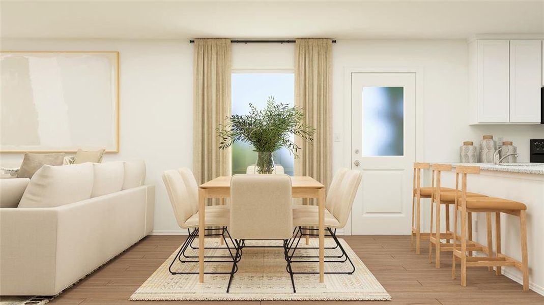 Dining space featuring light hardwood / wood-style flooring