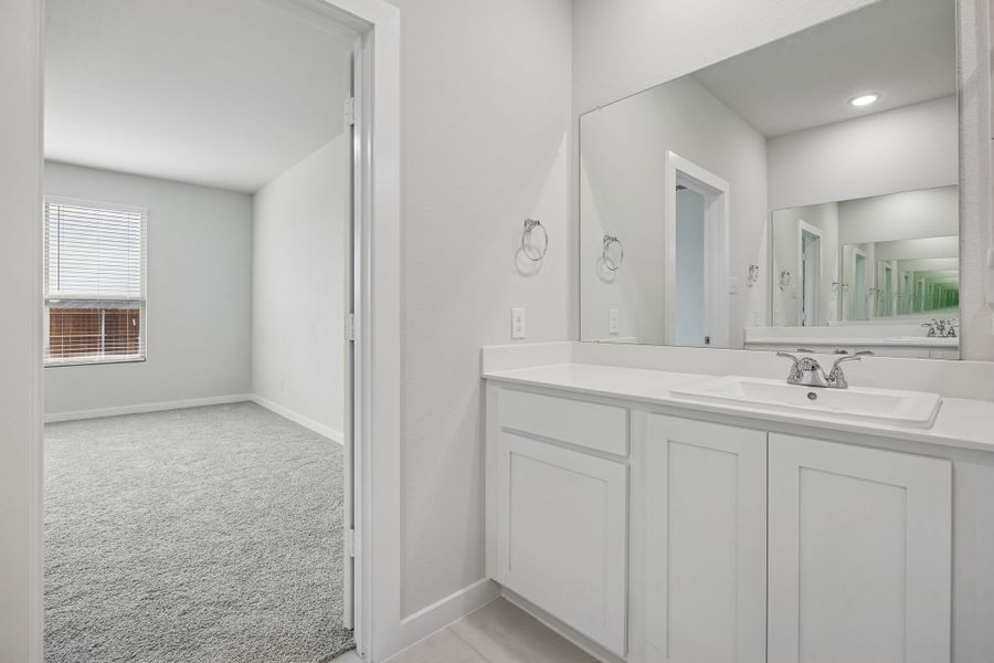 Primary Bathroom in the Masters home plan by Trophy Signature Homes – REPRESENTATIVE PHOTO