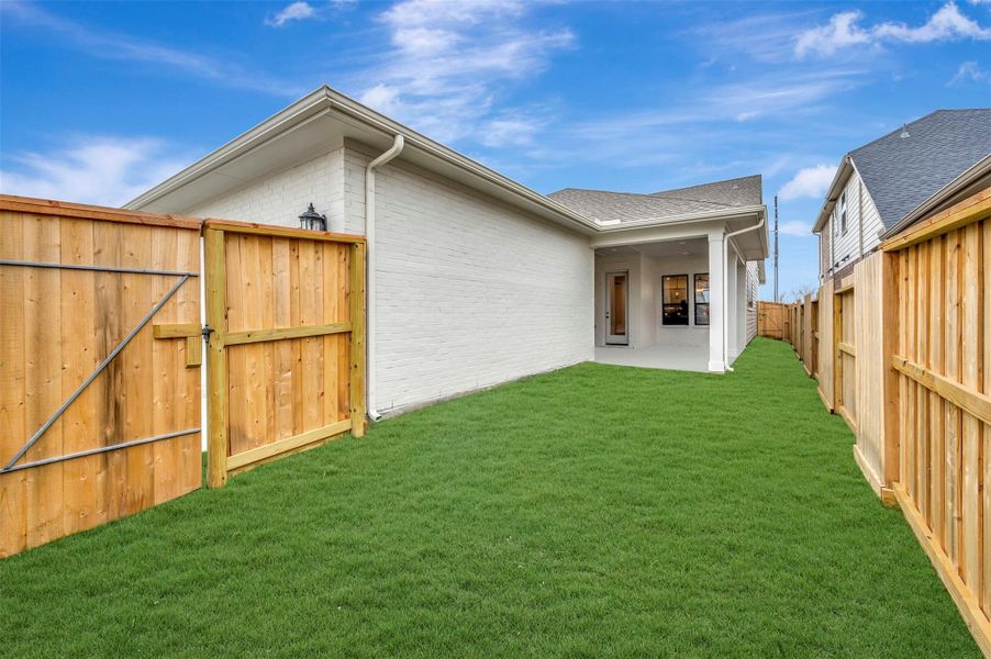 Exterior details and patio area of a home in Riceland 50’ Alley Load Homesites, Mont Belvieu (Image 3).
