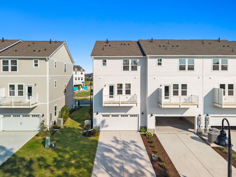 Front exterior of a new home in Lakeside Townes at Riverlights, Wilmington, NC, highlighting curb appeal (Image 22). Front exterior of a new home in Lakeside Townes at Riverlights, Wilmington, NC, highlighting curb appeal (Image 22).