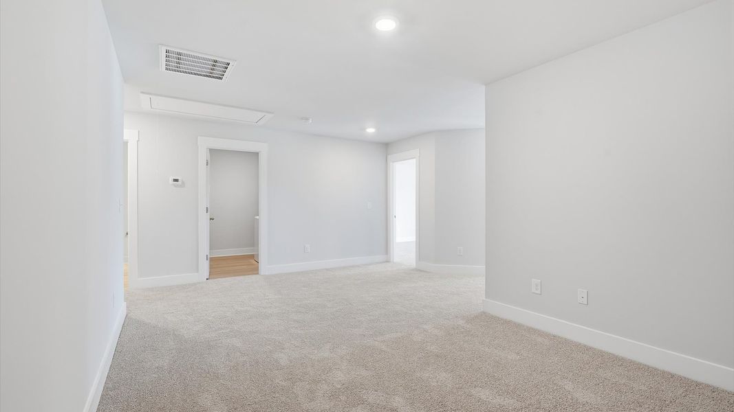 Accomplished upstairs loft with plush carpet and versatile functionality