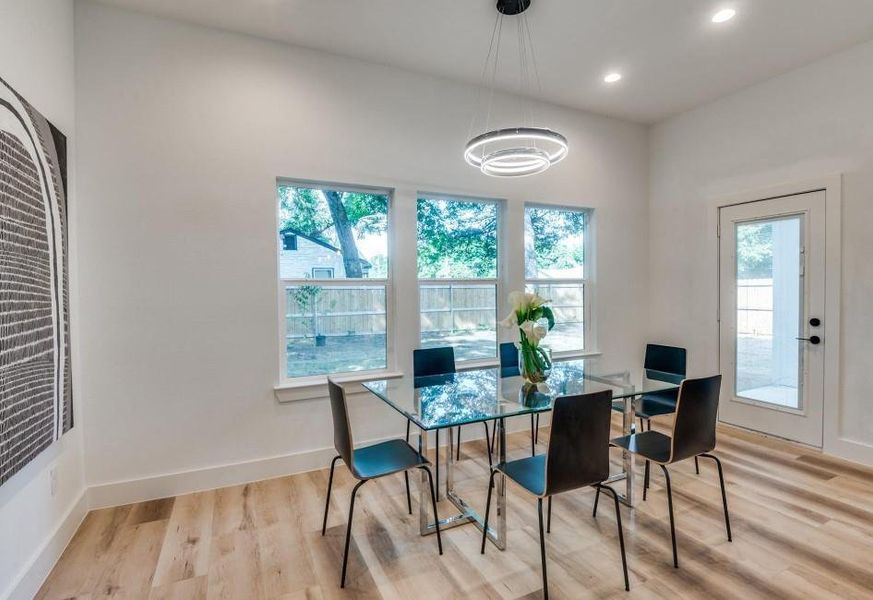 Dining space featuring light hardwood / wood-style flooring and a wealth of natural light